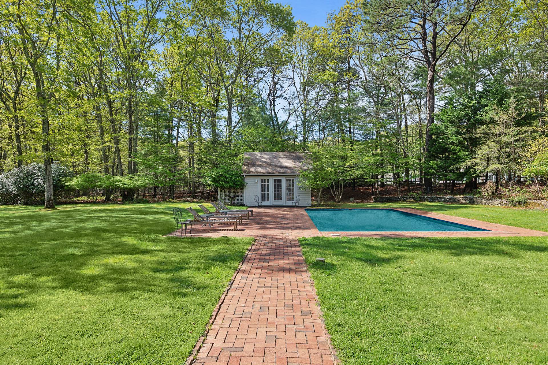 144 Hands Creek Road East Hampton, NY 11937 - Photo 27 of 32 a front view of a house with garden