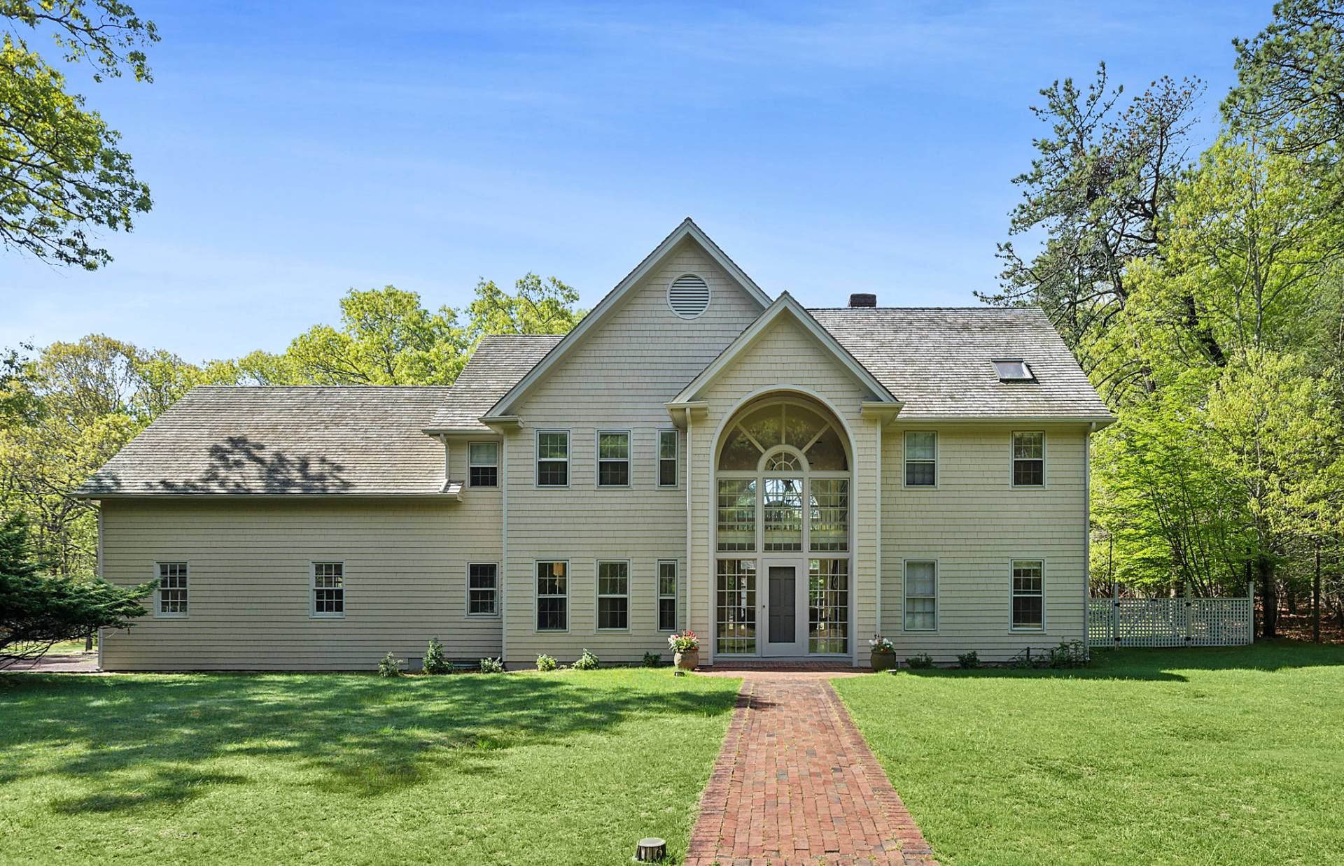 144 Hands Creek Road East Hampton, NY 11937 - Photo 3 of 32 a front view of house with yard and green space