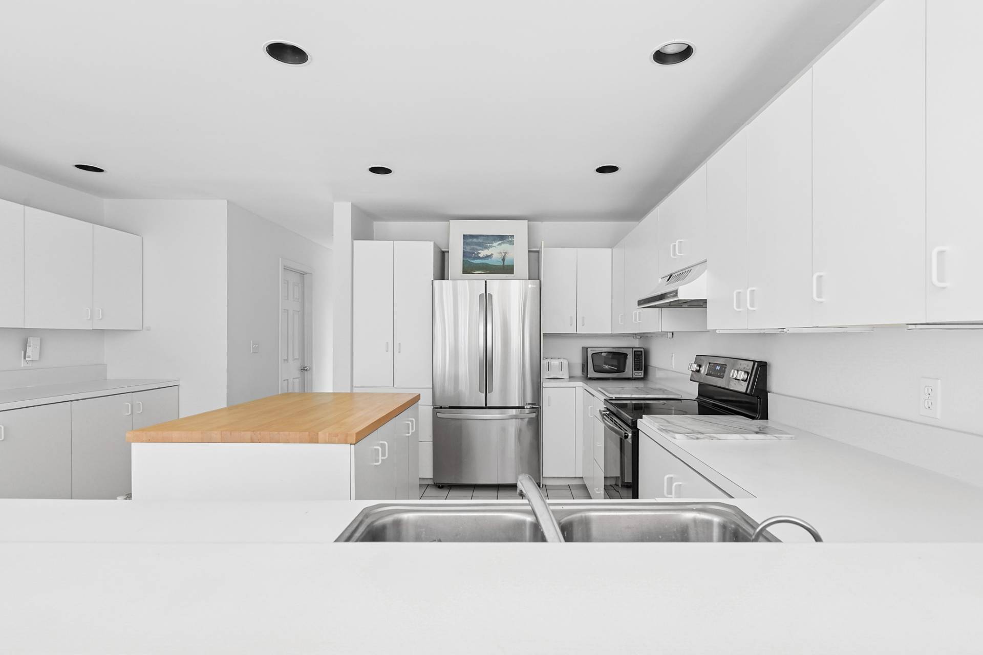 144 Hands Creek Road East Hampton, NY 11937 - Photo 8 of 32 a kitchen with stainless steel appliances granite countertop a refrigerator and a sink