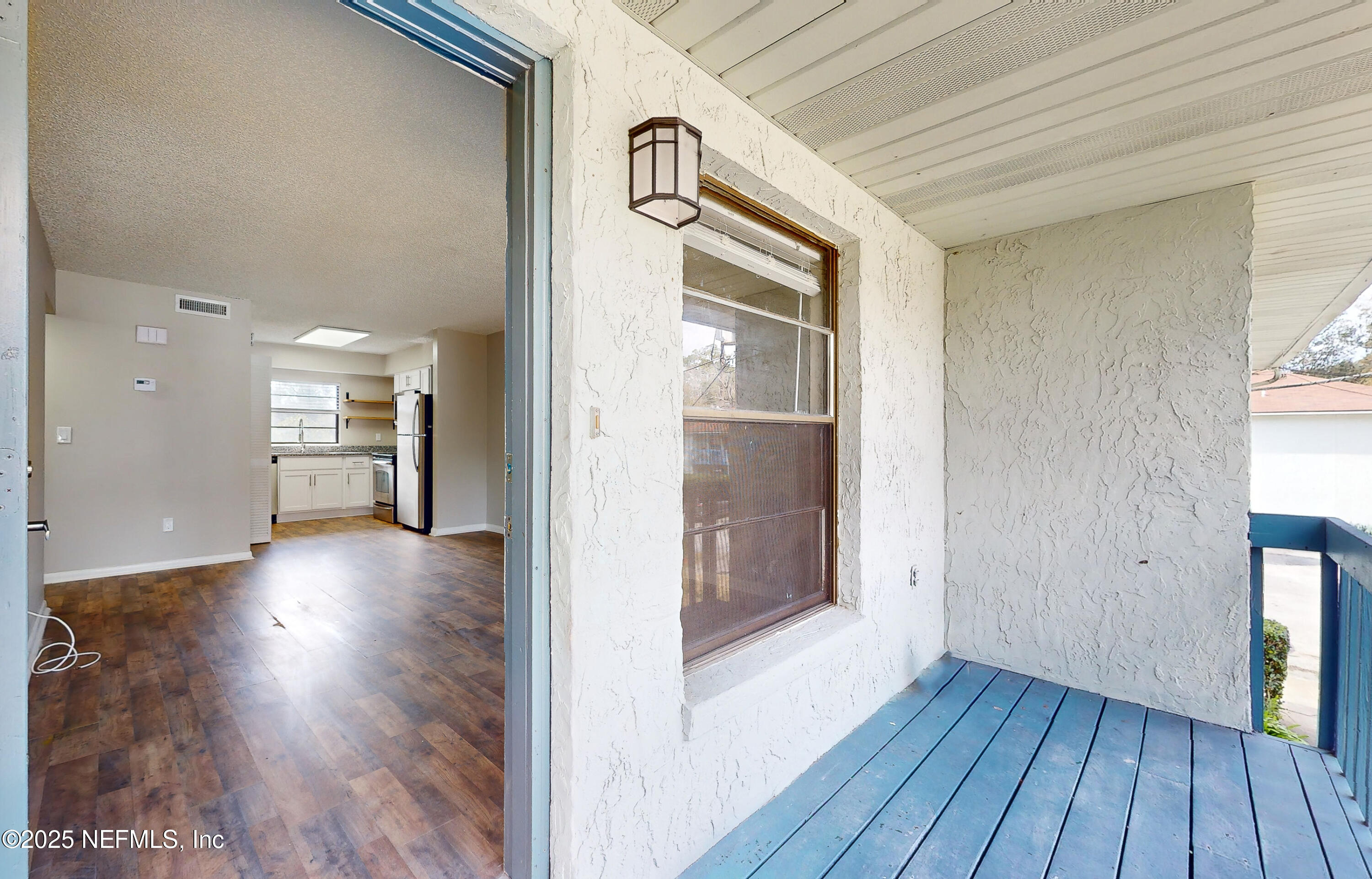 7080 Wiley Road, Unit 3 Jacksonville, FL 32210 - Photo 1 of 18 Porch/Living Room