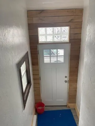 a view of empty room with window and stairs