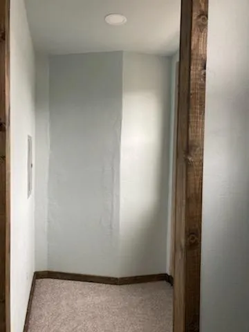 an empty room with wooden floor