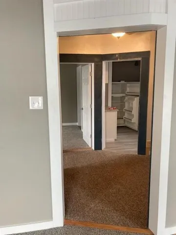 a view of a room that has a large window