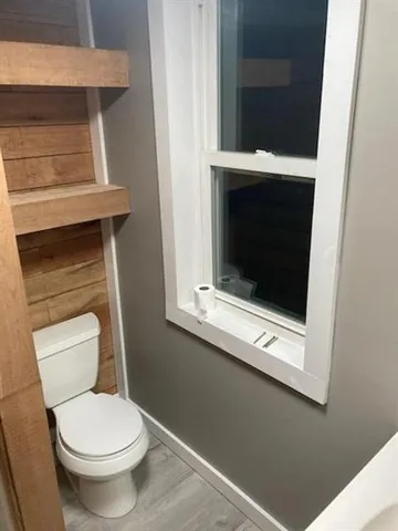 a bathroom with a toilet and a sink