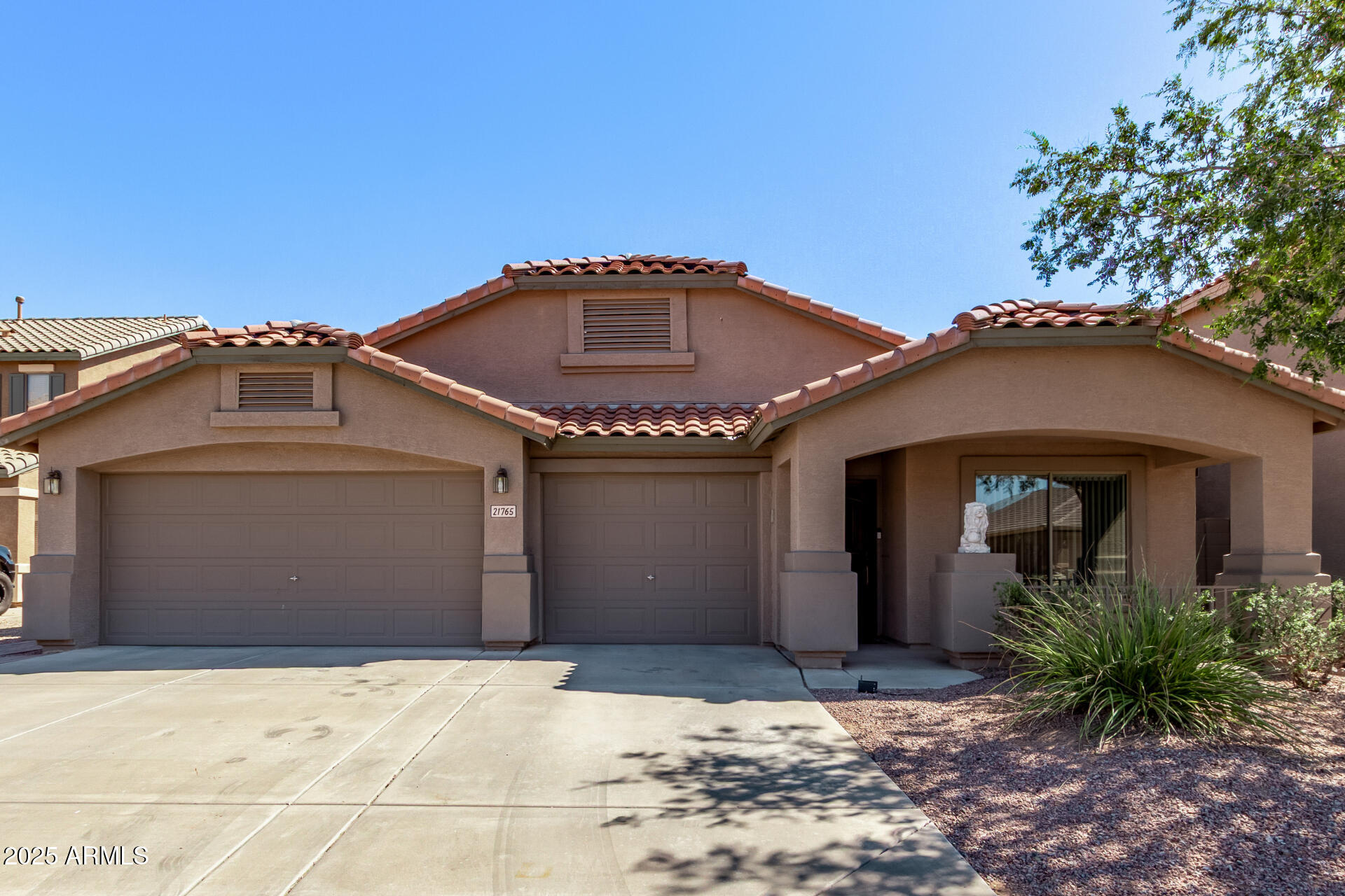 21765 Backus Drive Maricopa, AZ 85138 - Photo 1 of 43 a front view of a house with a yard