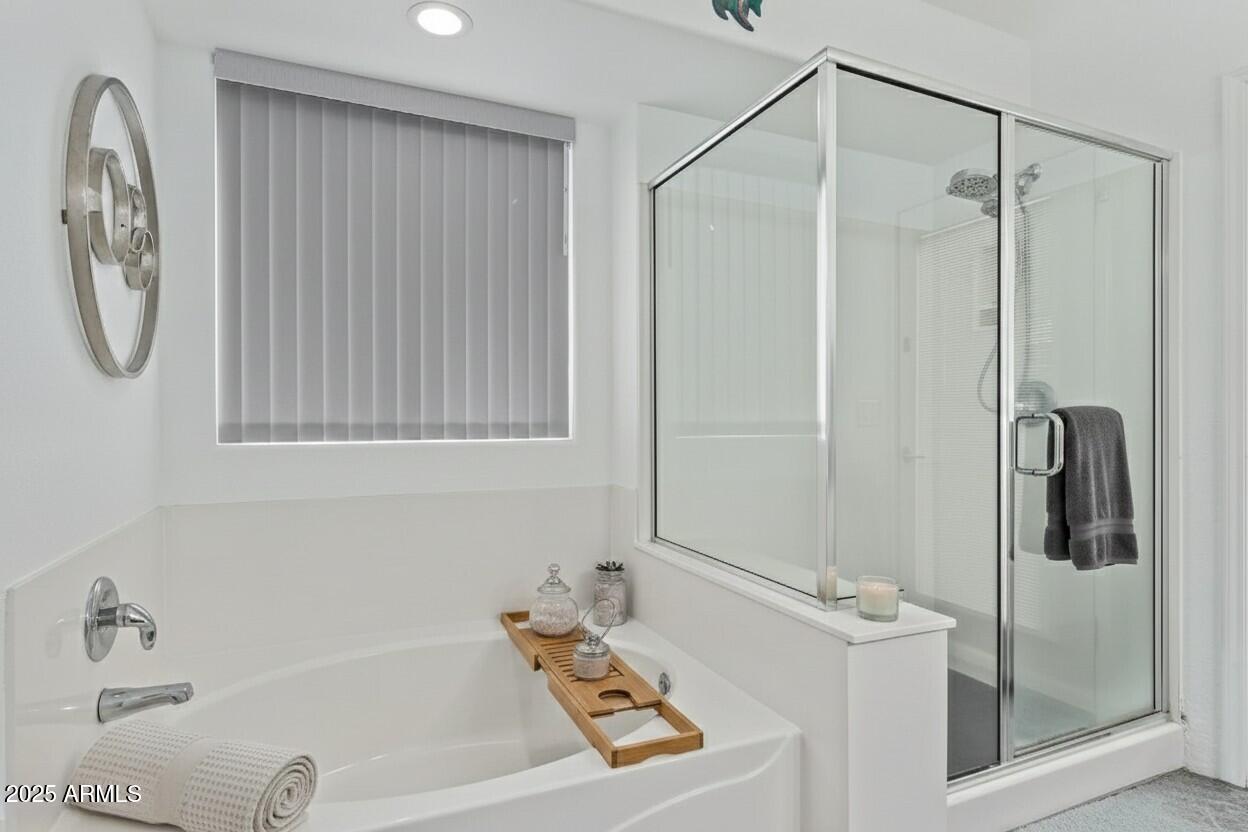 21765 Backus Drive Maricopa, AZ 85138 - Photo 12 of 43 a bathroom with a tub and a shower
