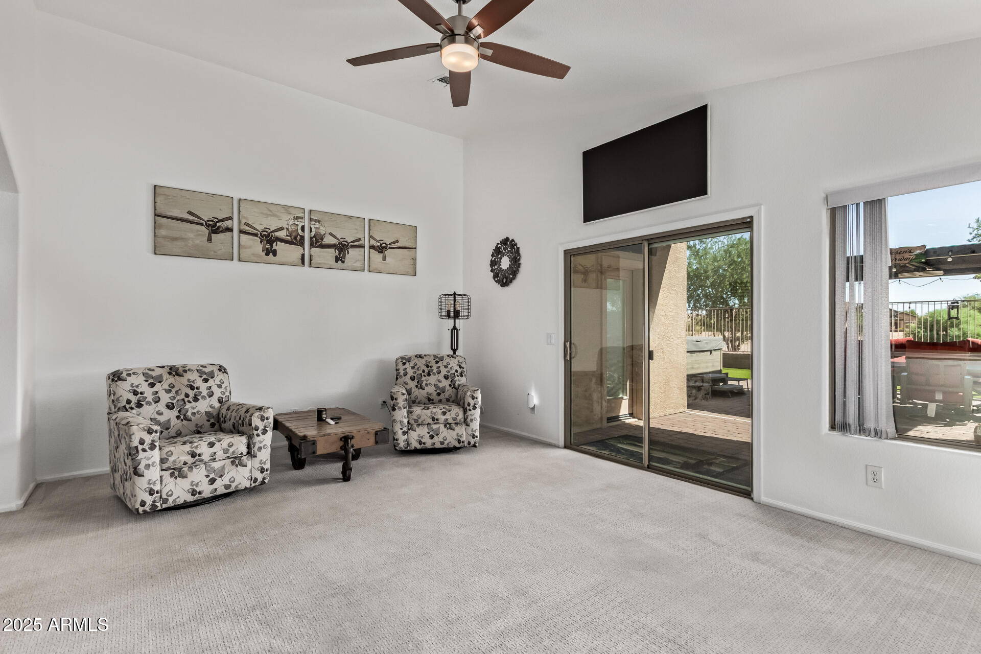 21765 Backus Drive Maricopa, AZ 85138 - Photo 17 of 43 a bed room with furniture and a flat screen tv