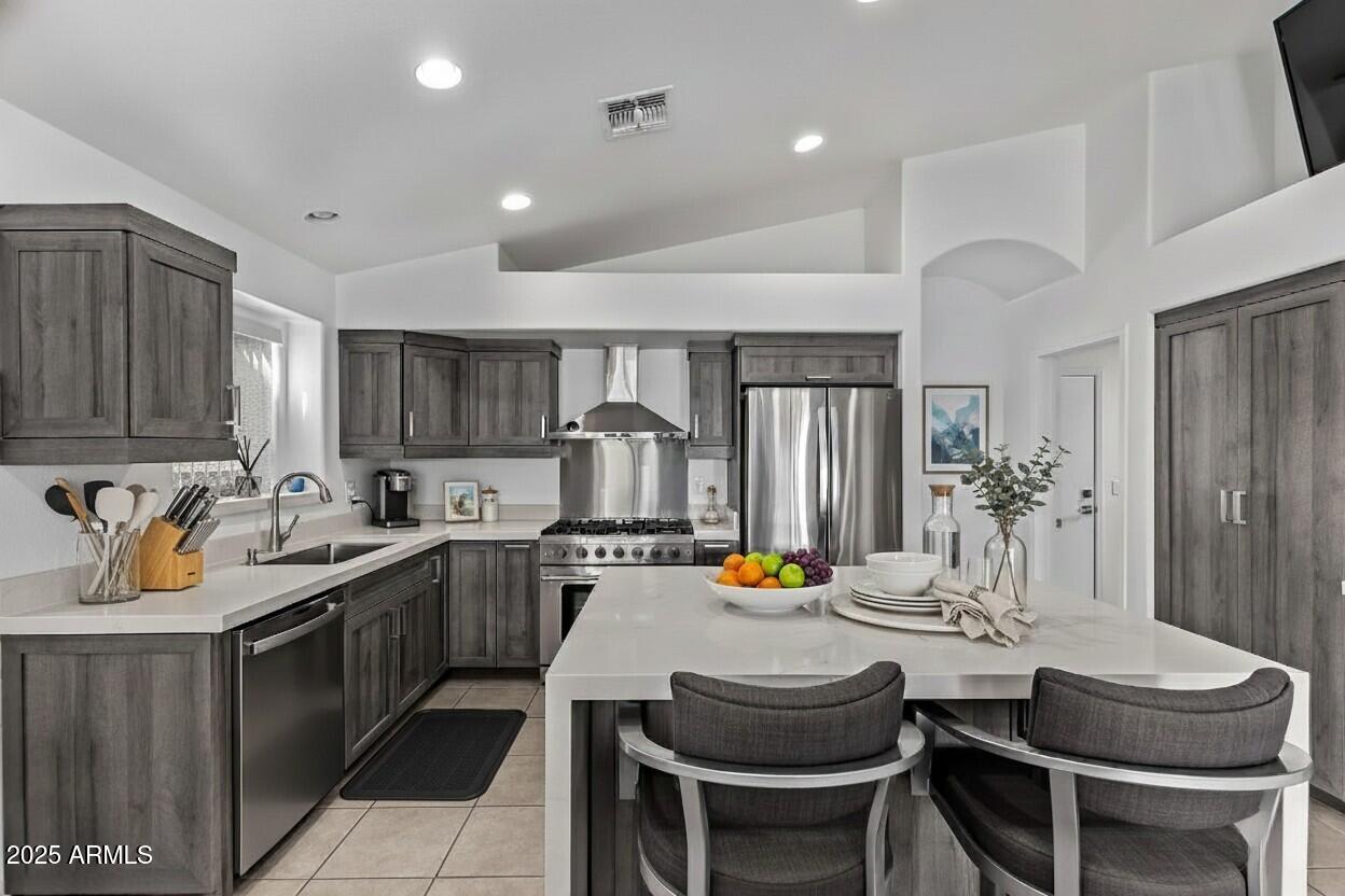 21765 Backus Drive Maricopa, AZ 85138 - Photo 19 of 43 a kitchen with a sink and chairs