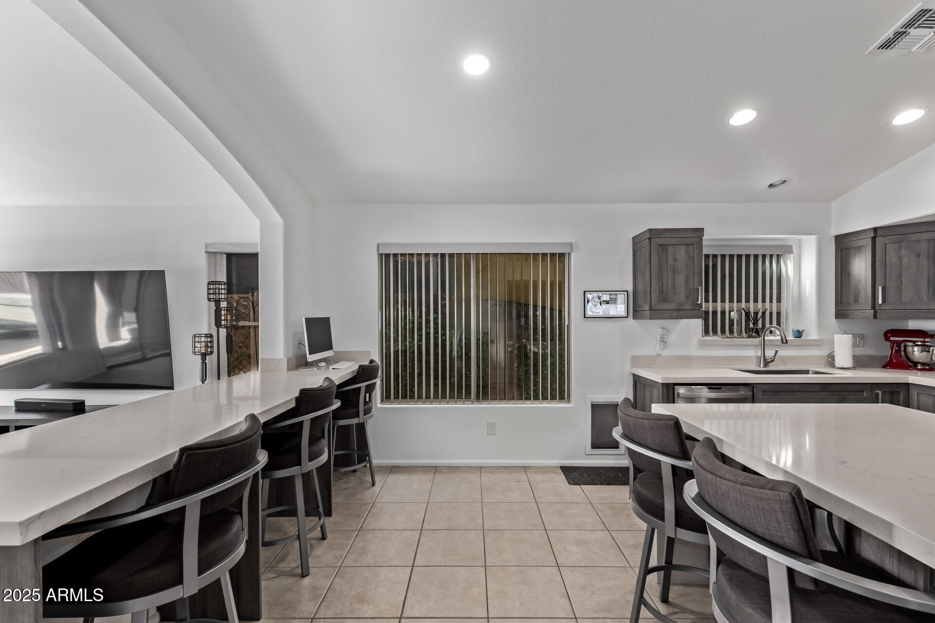 21765 Backus Drive Maricopa, AZ 85138 - Photo 21 of 43 a large kitchen with a table and chairs
