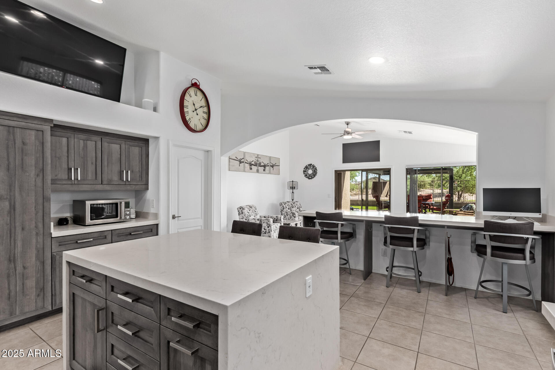21765 Backus Drive Maricopa, AZ 85138 - Photo 23 of 43 a kitchen with a stove a table and chairs in it