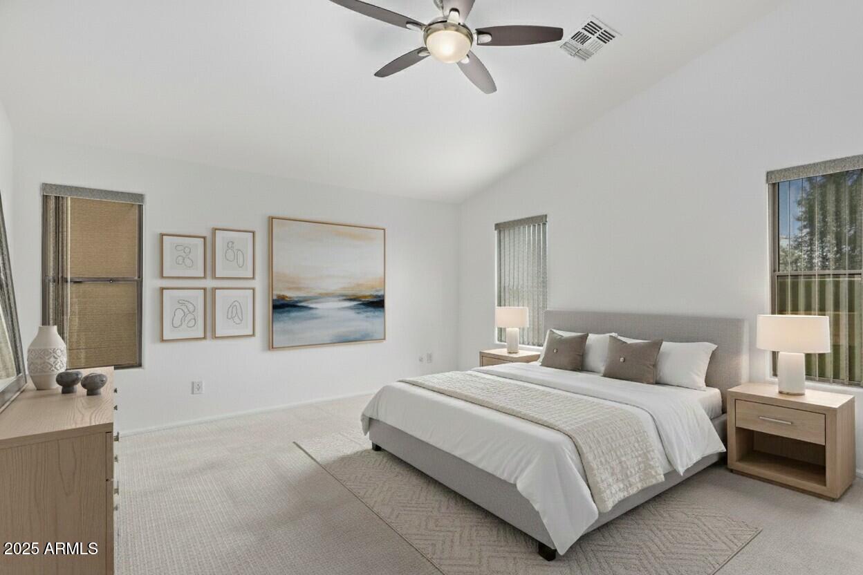 21765 Backus Drive Maricopa, AZ 85138 - Photo 24 of 43 a bedroom with a bed and a painting on the wall