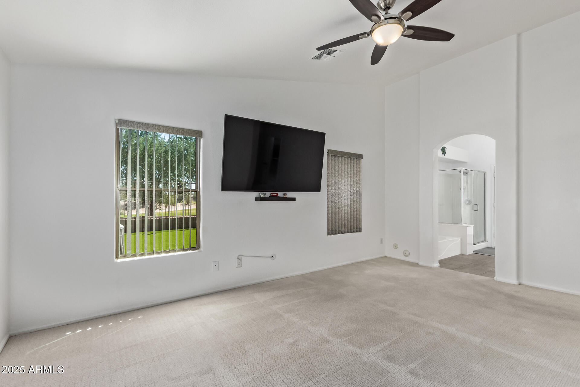 21765 Backus Drive Maricopa, AZ 85138 - Photo 25 of 43 a view of a livingroom with a flat screen tv