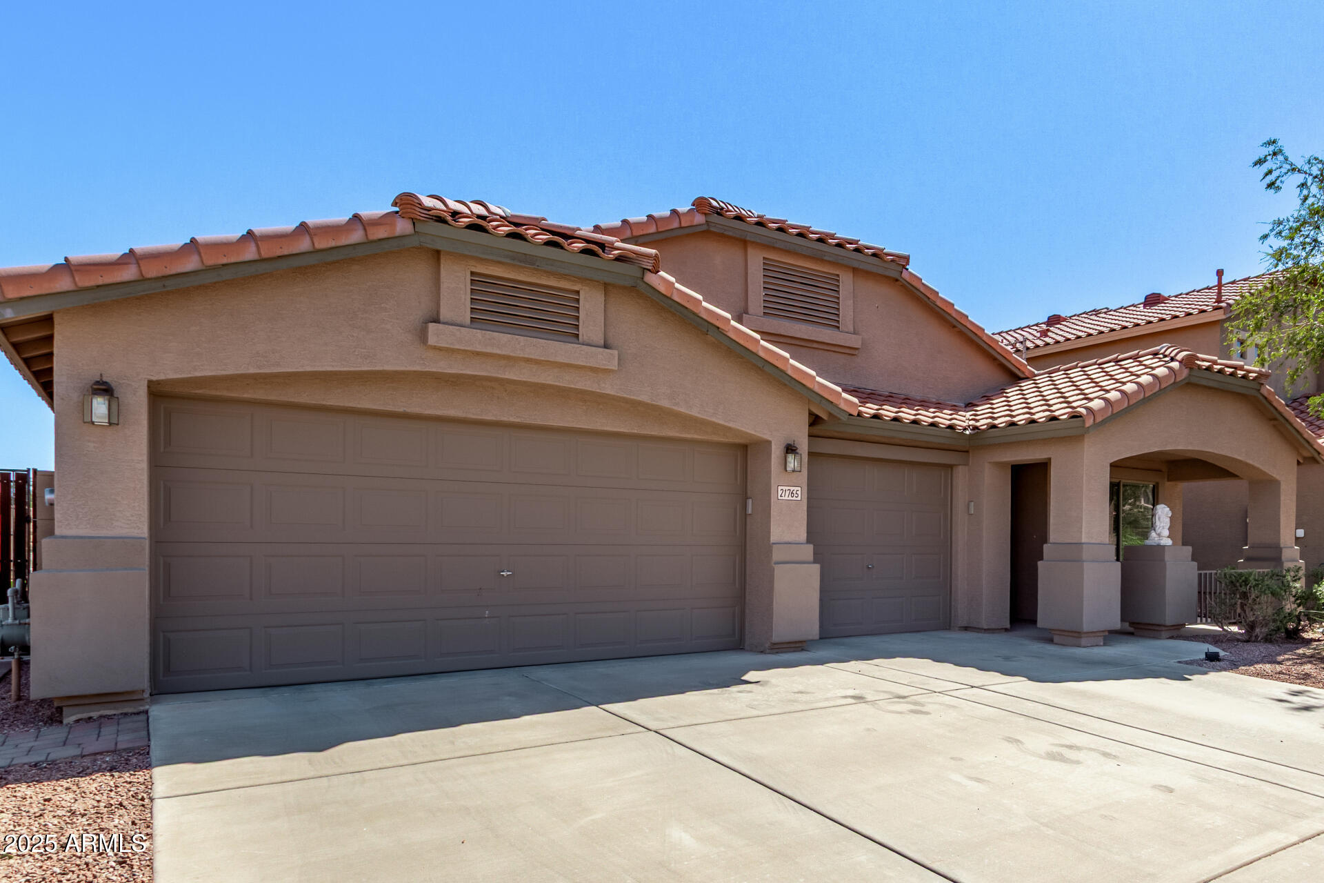 21765 Backus Drive Maricopa, AZ 85138 - Photo 3 of 43 a front view of a house