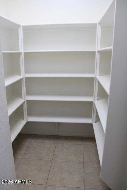 21765 Backus Drive Maricopa, AZ 85138 - Photo 32 of 43 a view of walk in closet with empty racks