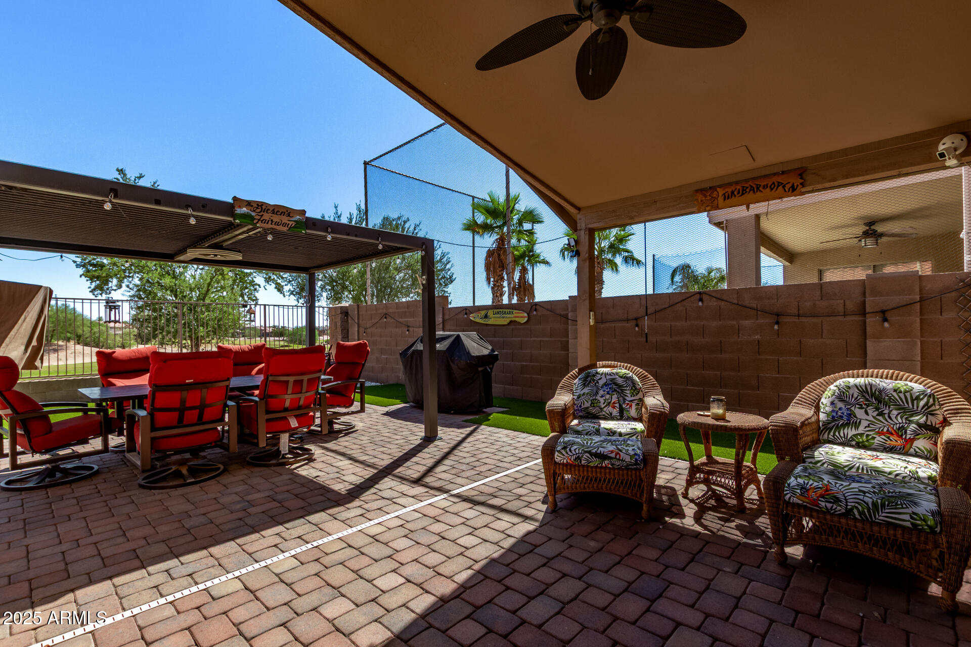 21765 Backus Drive Maricopa, AZ 85138 - Photo 34 of 43 a view of a patio with table and chairs under an umbrella