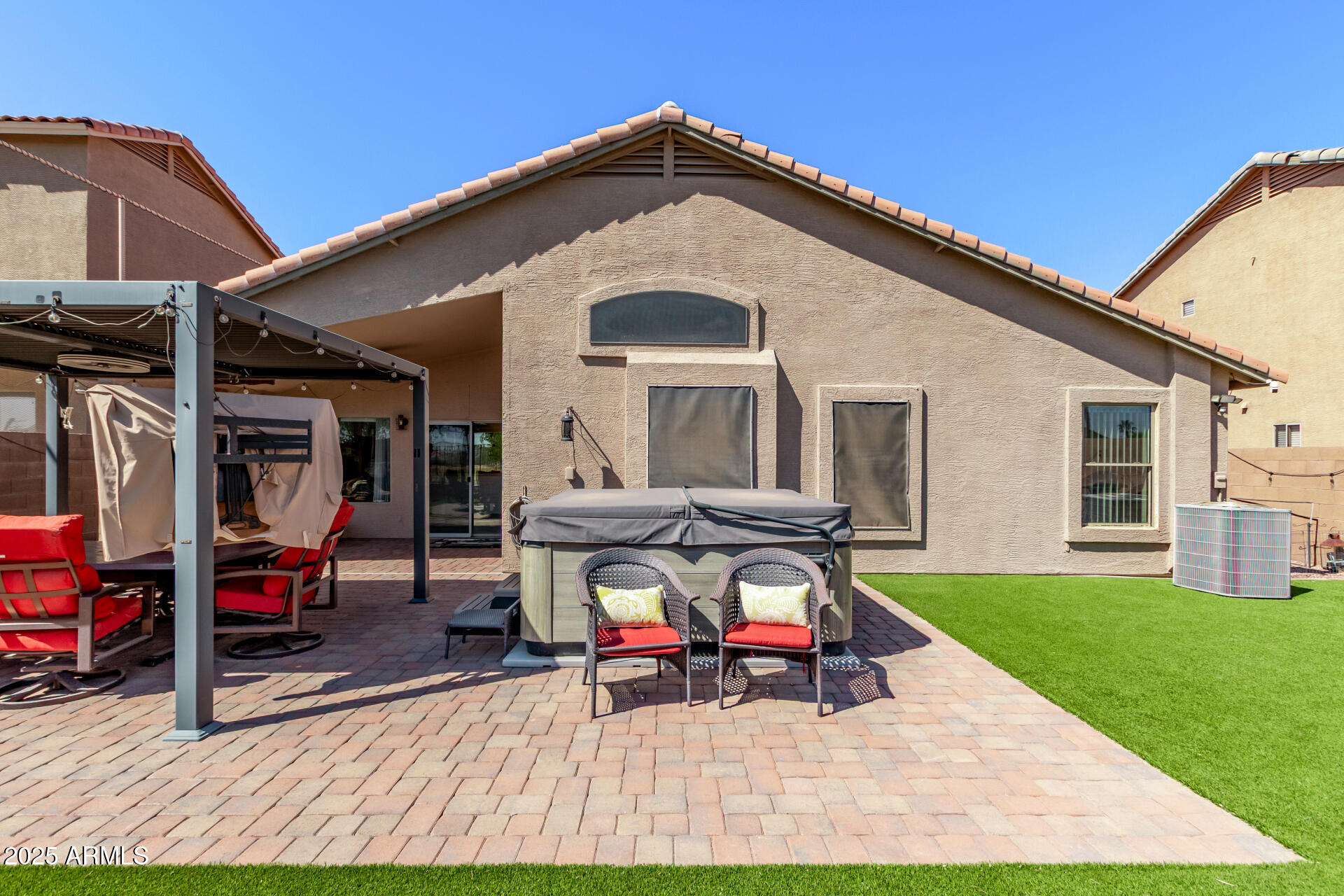 21765 Backus Drive Maricopa, AZ 85138 - Photo 37 of 43 a view of a house with a patio and a slide