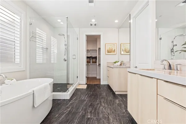 a bathroom with a sink a mirror and a shower