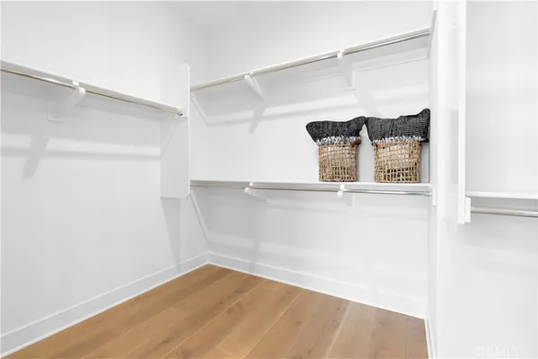 a view of a refrigerator in kitchen and wooden floor