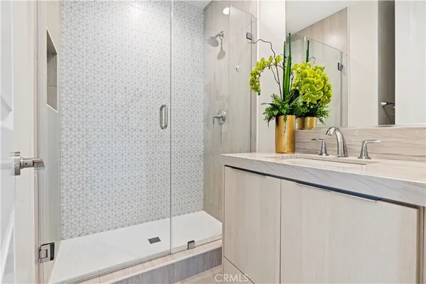 a bathroom with a sink a vanity and a mirror