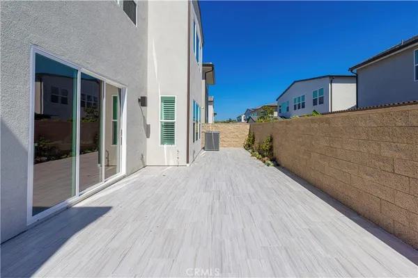 a view of a house with a wooden fence