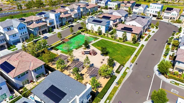 an aerial view of residential houses with outdoor space