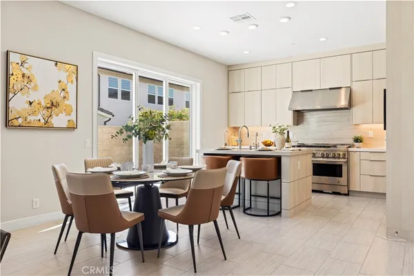 a view of kitchen with furniture and wooden floor