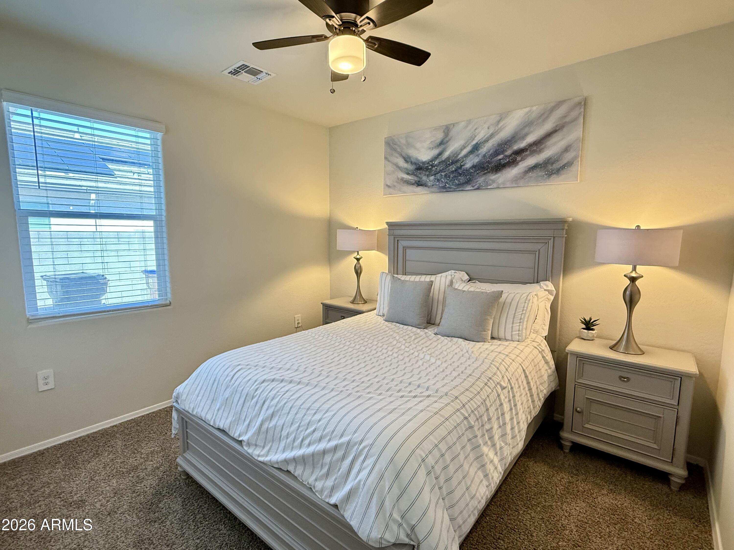 2207 South 46th Street Coolidge, AZ 85128 - Photo 19 of 35 a bedroom with a bed and a window