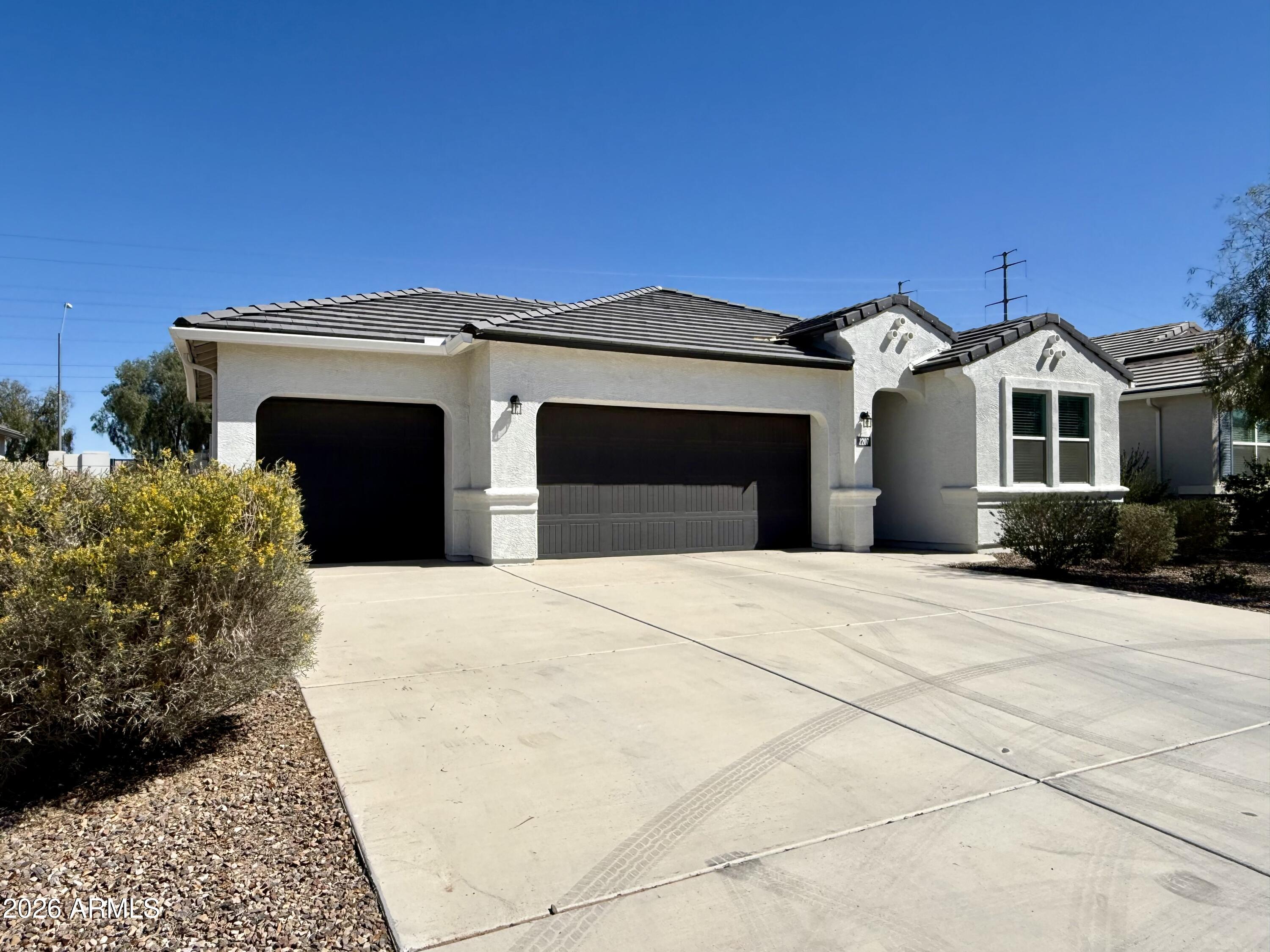 2207 South 46th Street Coolidge, AZ 85128 - Photo 2 of 35 a front view of a house with a yard