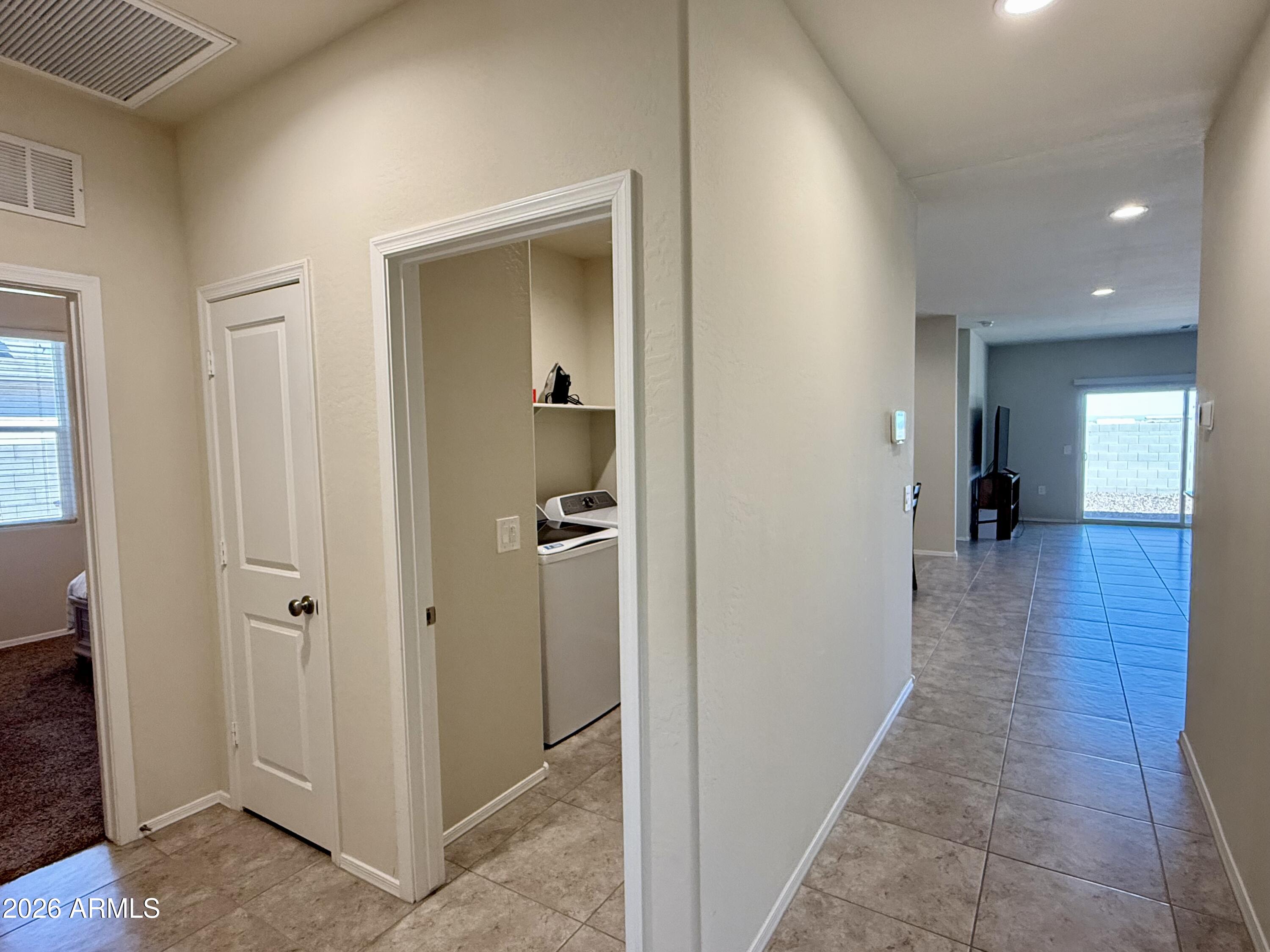 2207 South 46th Street Coolidge, AZ 85128 - Photo 22 of 35 a view of a hallway with a room and wooden floor