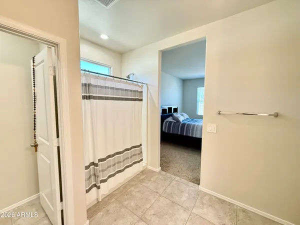a spacious bathroom with a double vanity sink and a mirror