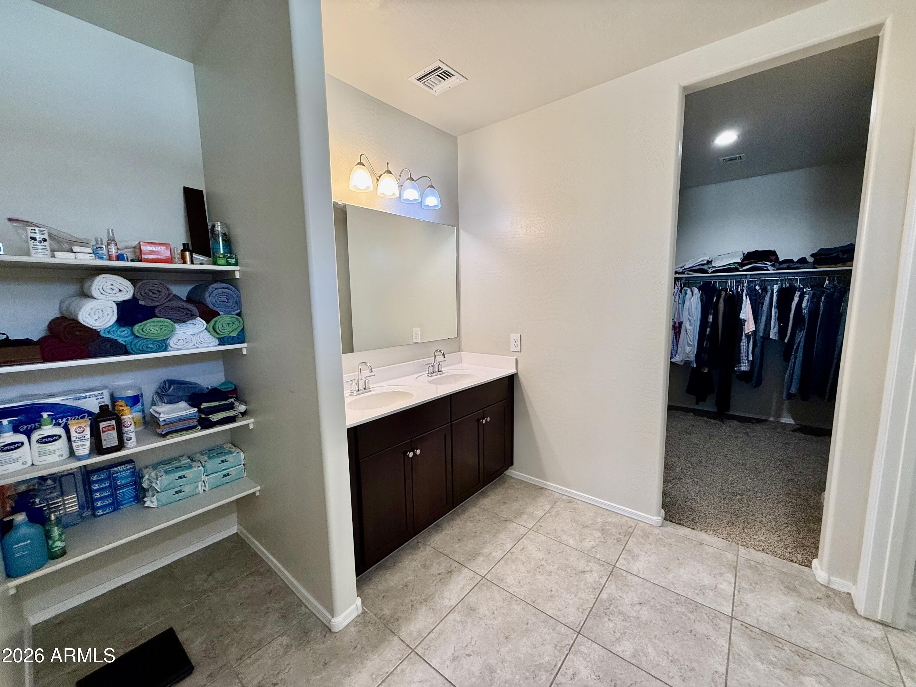 2207 South 46th Street Coolidge, AZ 85128 - Photo 28 of 35 a spacious bathroom with a double vanity sink and a mirror