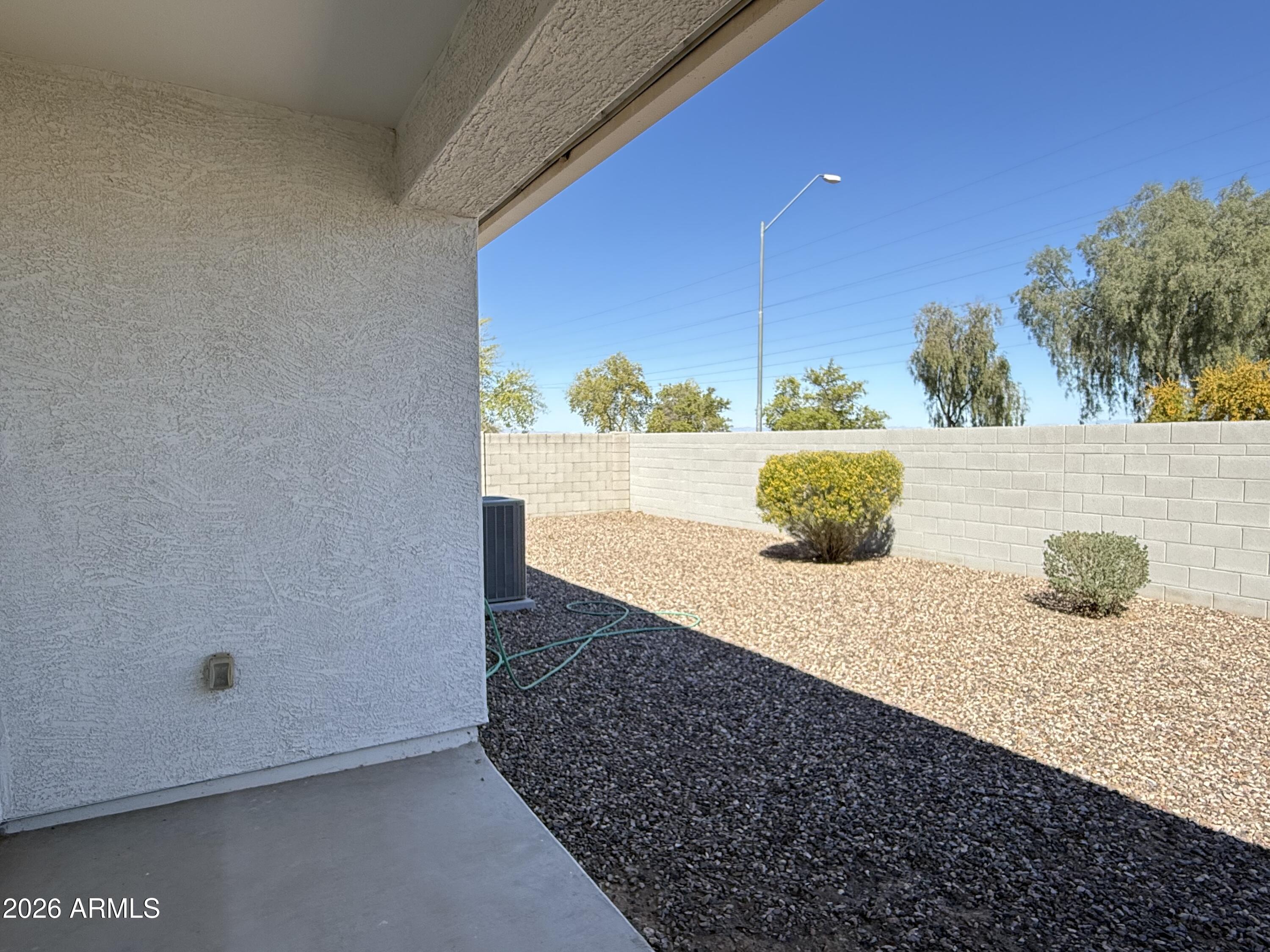 2207 South 46th Street Coolidge, AZ 85128 - Photo 30 of 35 a view of a floor to ceiling window and an empty room