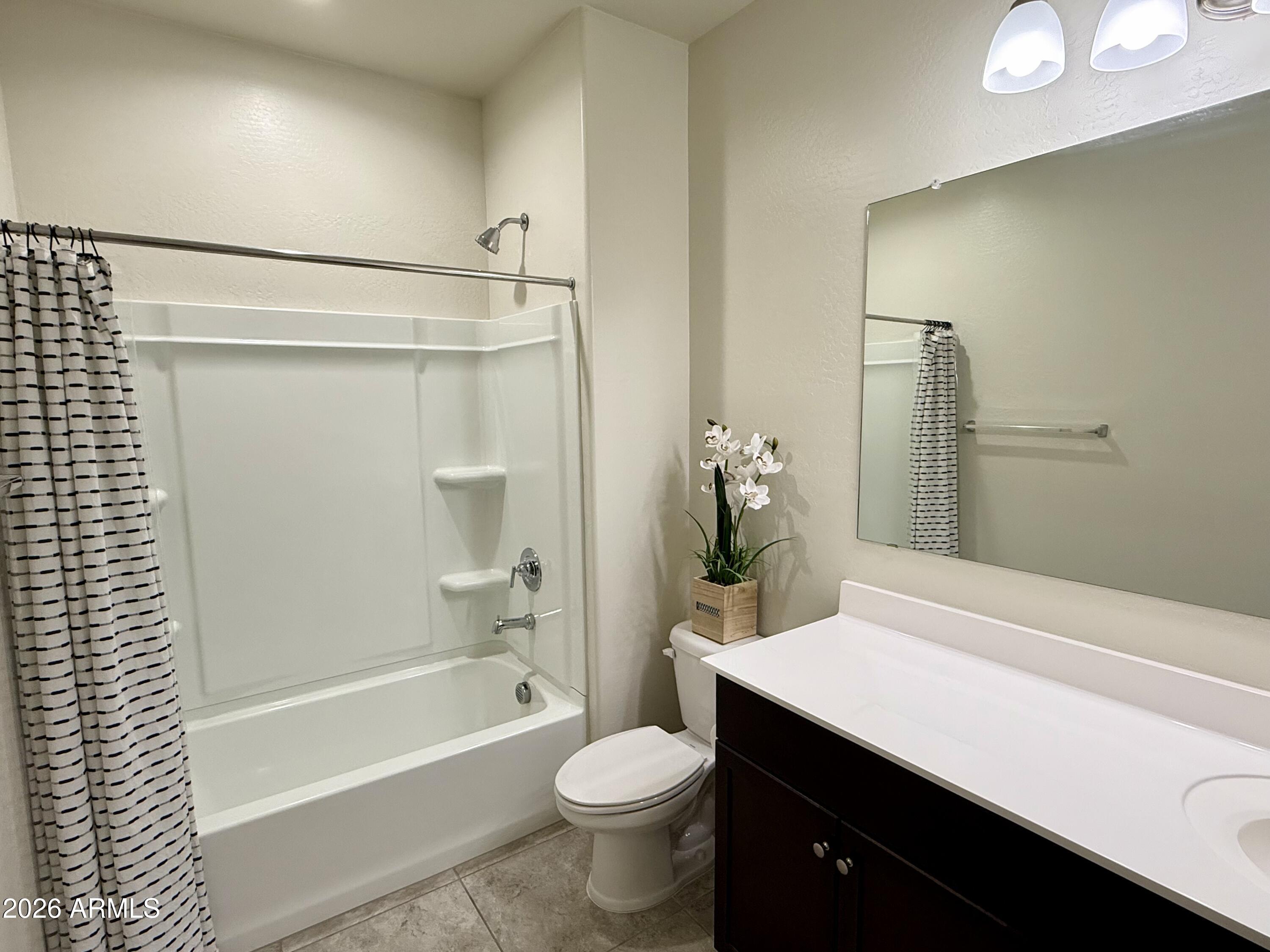 2207 South 46th Street Coolidge, AZ 85128 - Photo 6 of 35 a bathroom with a sink a toilet and shower