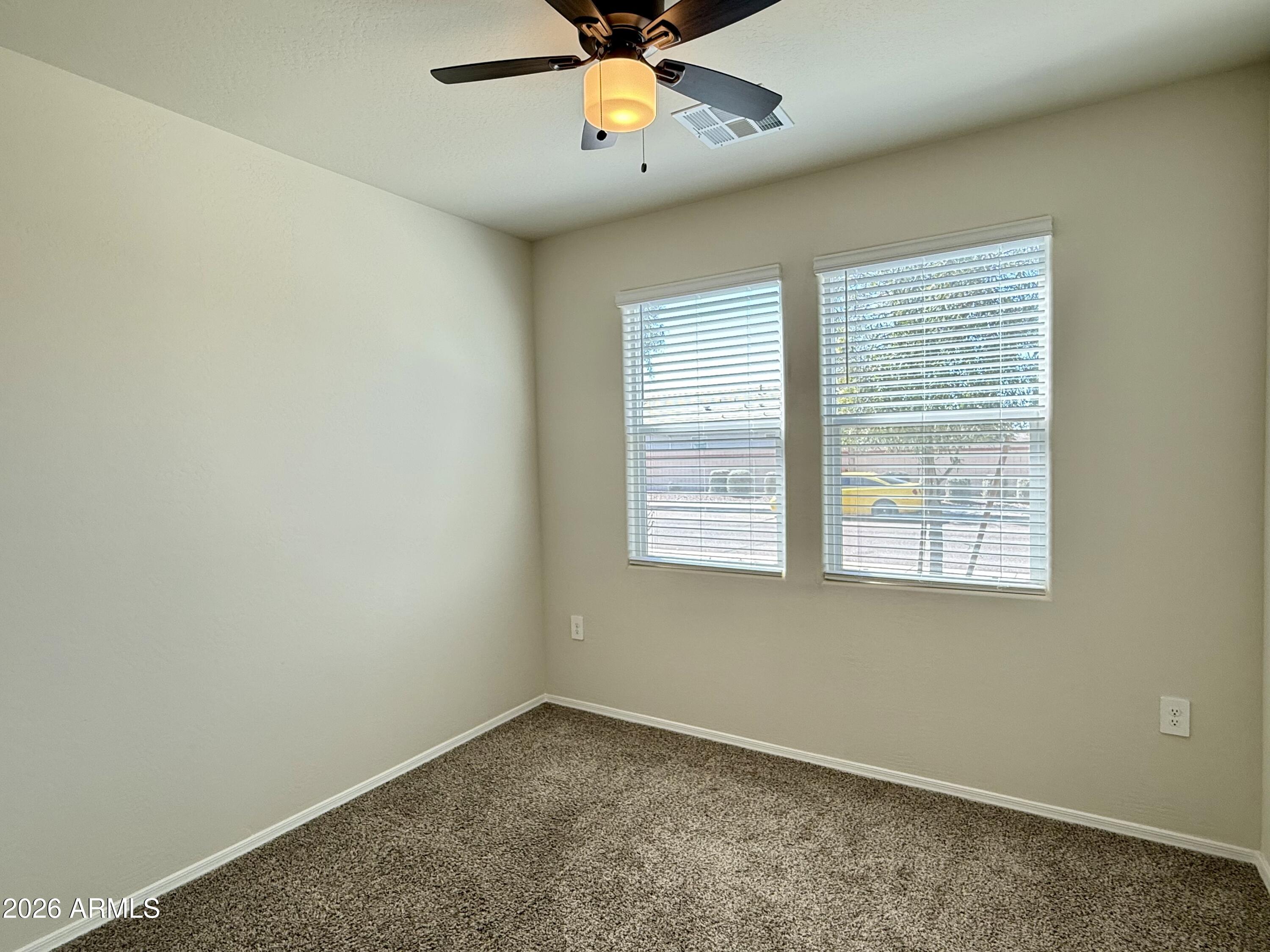 2207 South 46th Street Coolidge, AZ 85128 - Photo 8 of 35 an empty room with a window and a fan
