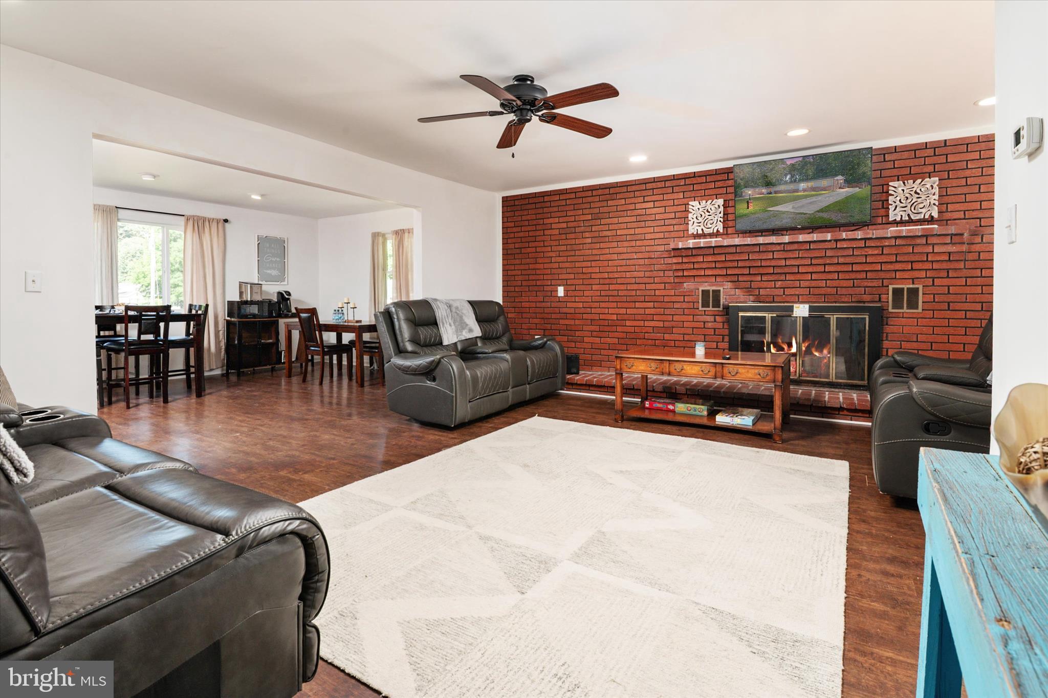 108 Wilson Road Grasonville, MD 21658 - Photo 27 of 38 a living room with furniture ceiling fan and a rug