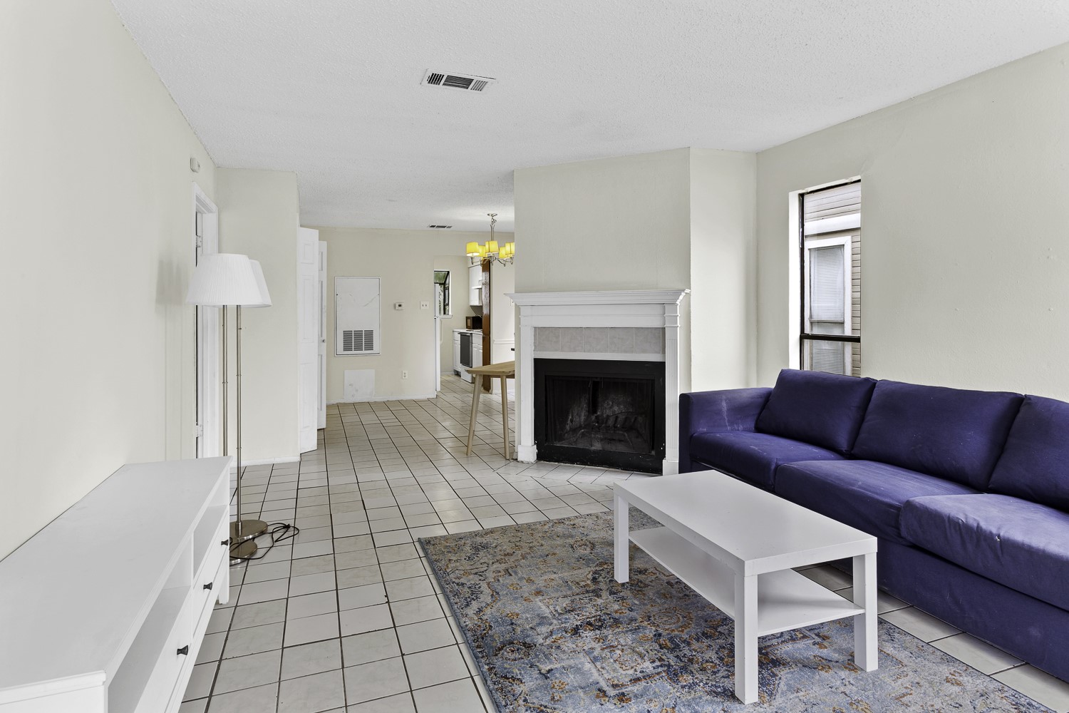 1907 West Loop Austin, TX 78758 - Photo 11 of 31 a living room with furniture and a fireplace