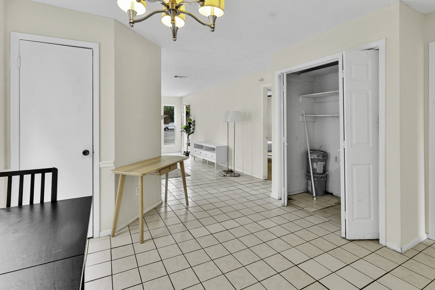 1907 West Loop Austin, TX 78758 - Photo 13 of 31 Dining area open to living room and kitchen with utility closet for full size washer/dryer.