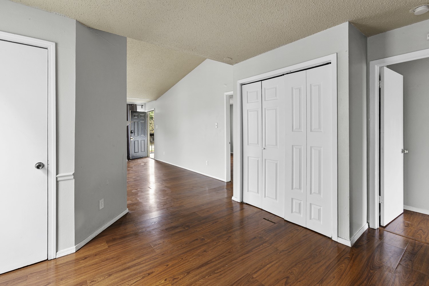 1907 West Loop Austin, TX 78758 - Photo 17 of 22 a view of a hallway with wooden floor