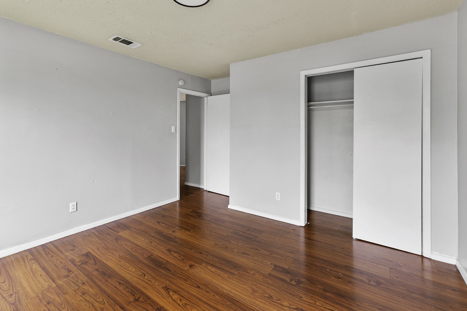 1907 West Loop Austin, TX 78758 - Photo 27 of 31 a view of an empty room with wooden floor