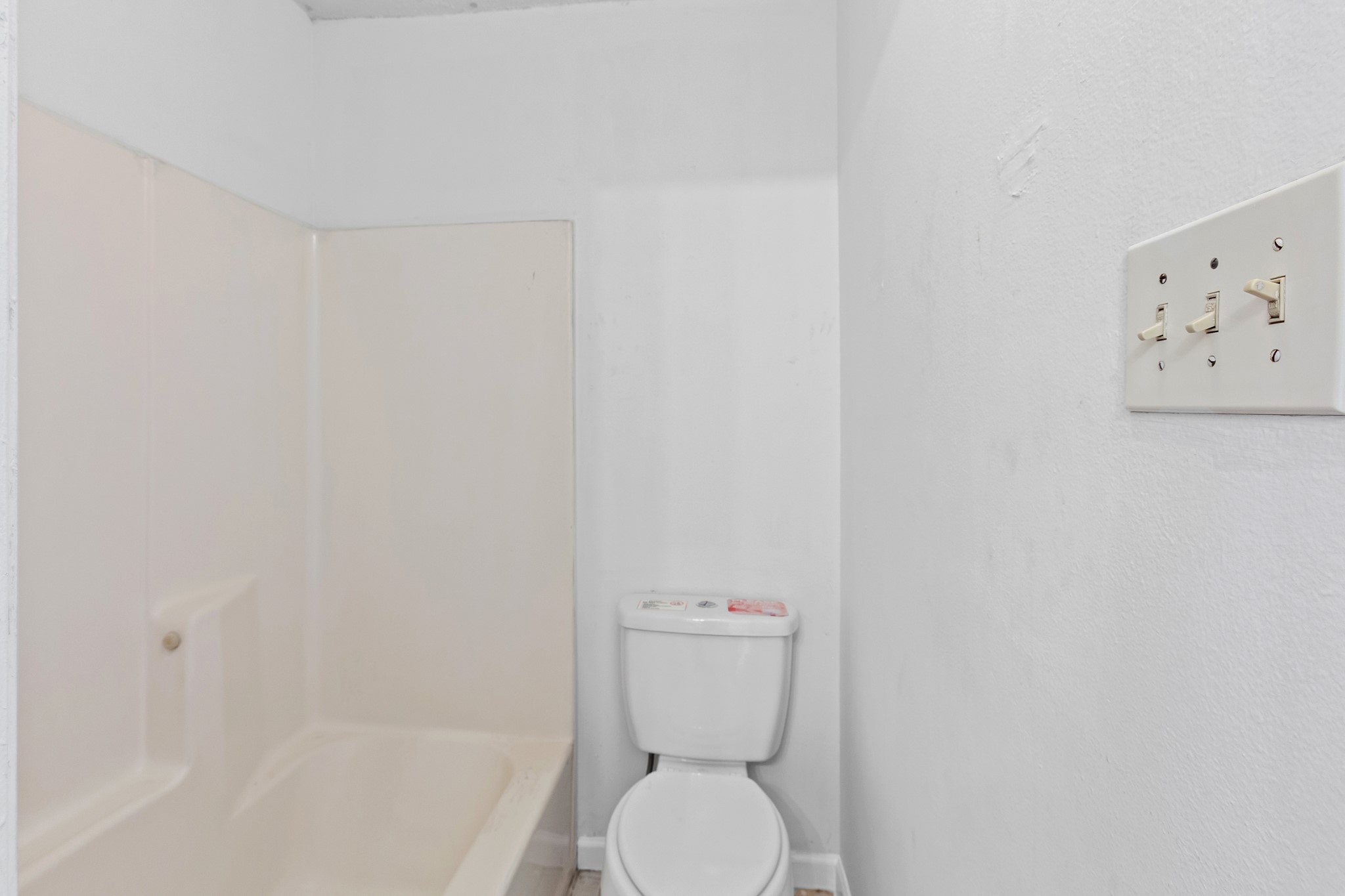 1907 West Loop Austin, TX 78758 - Photo 31 of 31 a white toilet sitting next to a shower