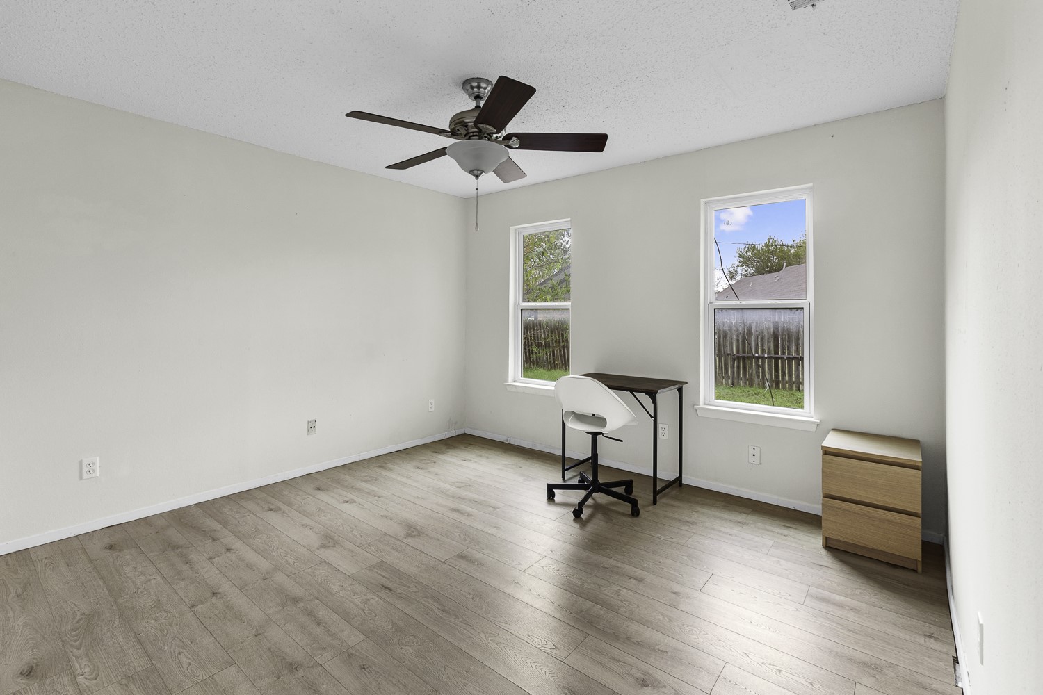 1907 West Loop Austin, TX 78758 - Photo 9 of 22 a view of a workspace with furniture and a window