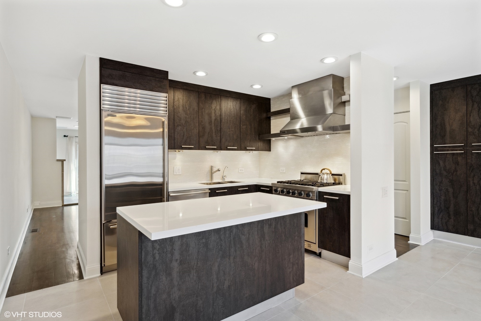 641 West Willow Street, Unit 117 Chicago, IL 60614 - Photo 11 of 44 a kitchen with a sink a stove and refrigerator