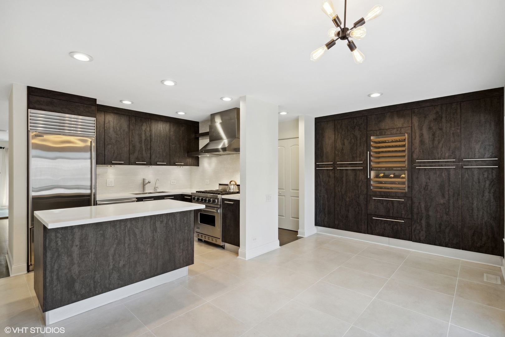 641 West Willow Street, Unit 117 Chicago, IL 60614 - Photo 12 of 44 a kitchen with stainless steel appliances granite countertop a refrigerator and a sink