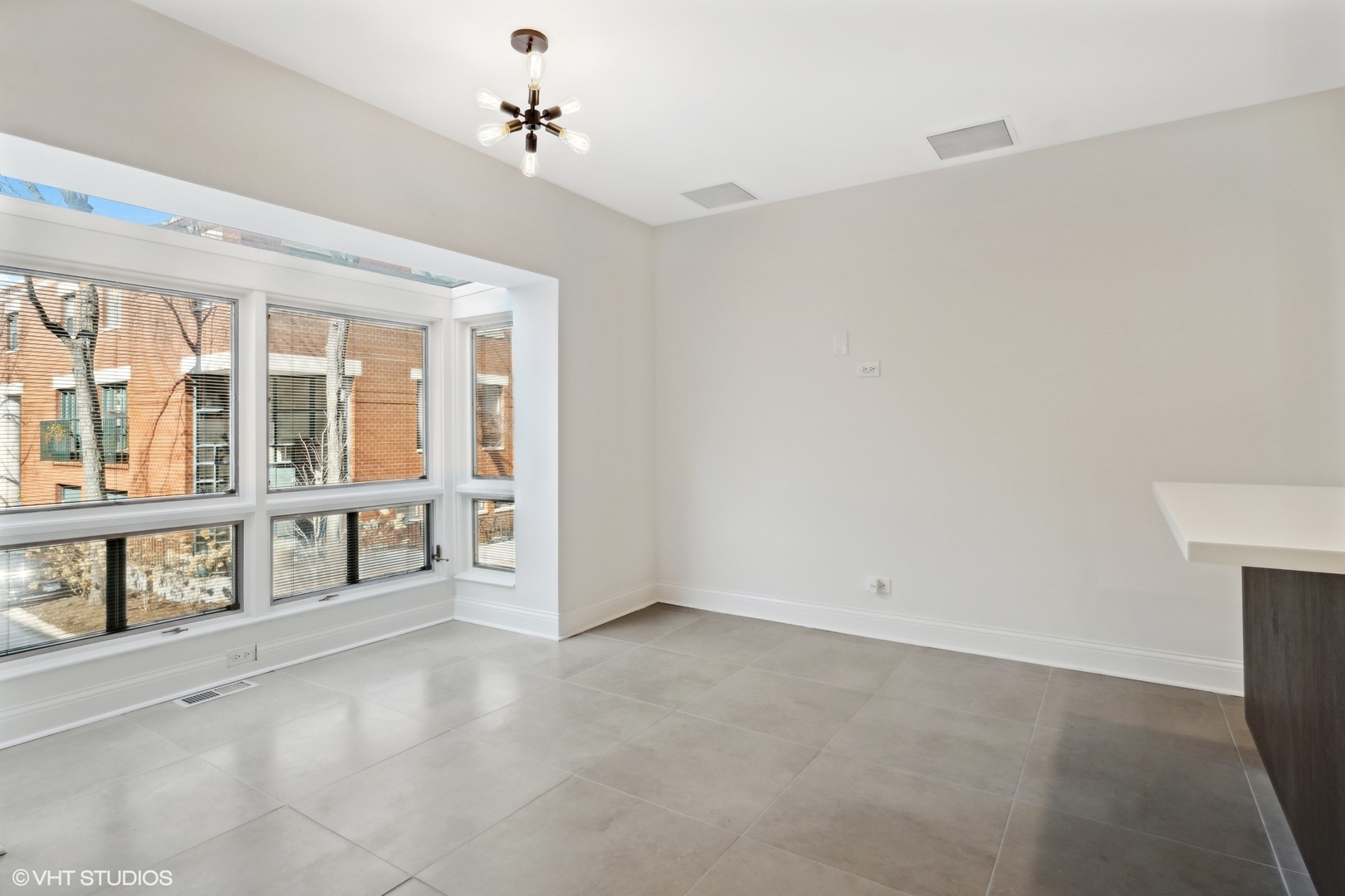 641 West Willow Street, Unit 117 Chicago, IL 60614 - Photo 15 of 44 an empty room with windows and entrance