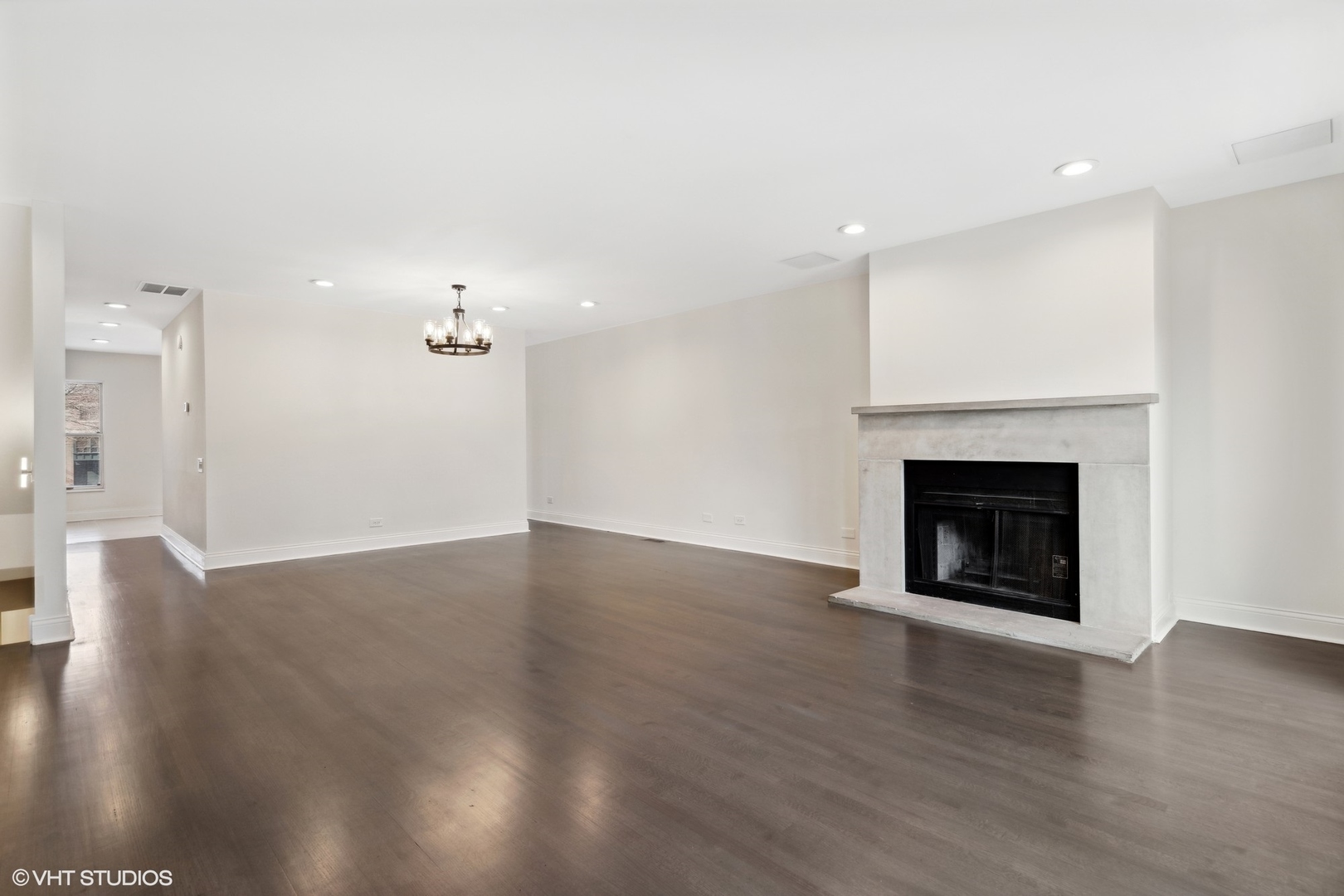 641 West Willow Street, Unit 117 Chicago, IL 60614 - Photo 24 of 44 a view of a livingroom with wooden floor and a fireplace