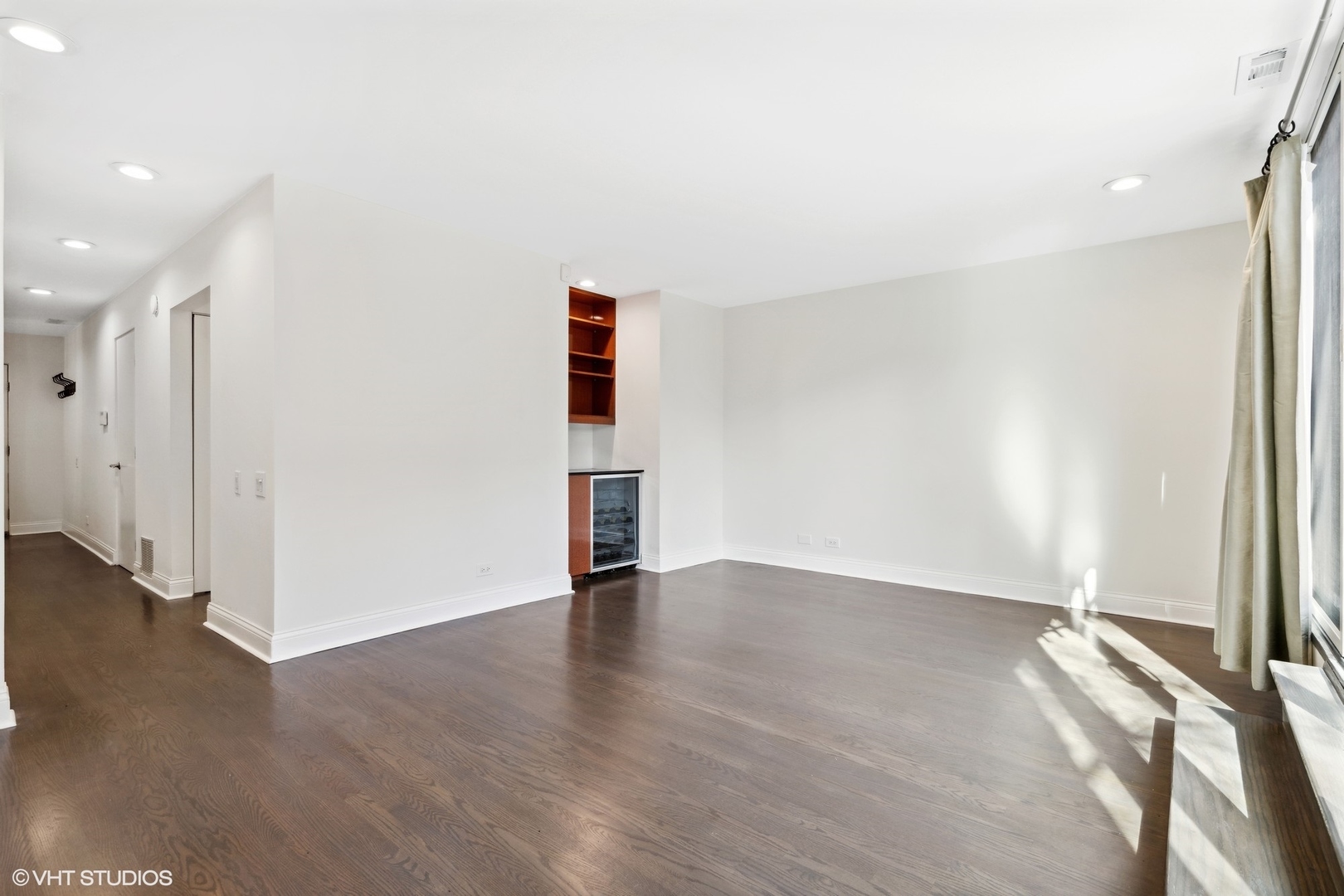 641 West Willow Street, Unit 117 Chicago, IL 60614 - Photo 28 of 44 an empty room with wooden floor and windows