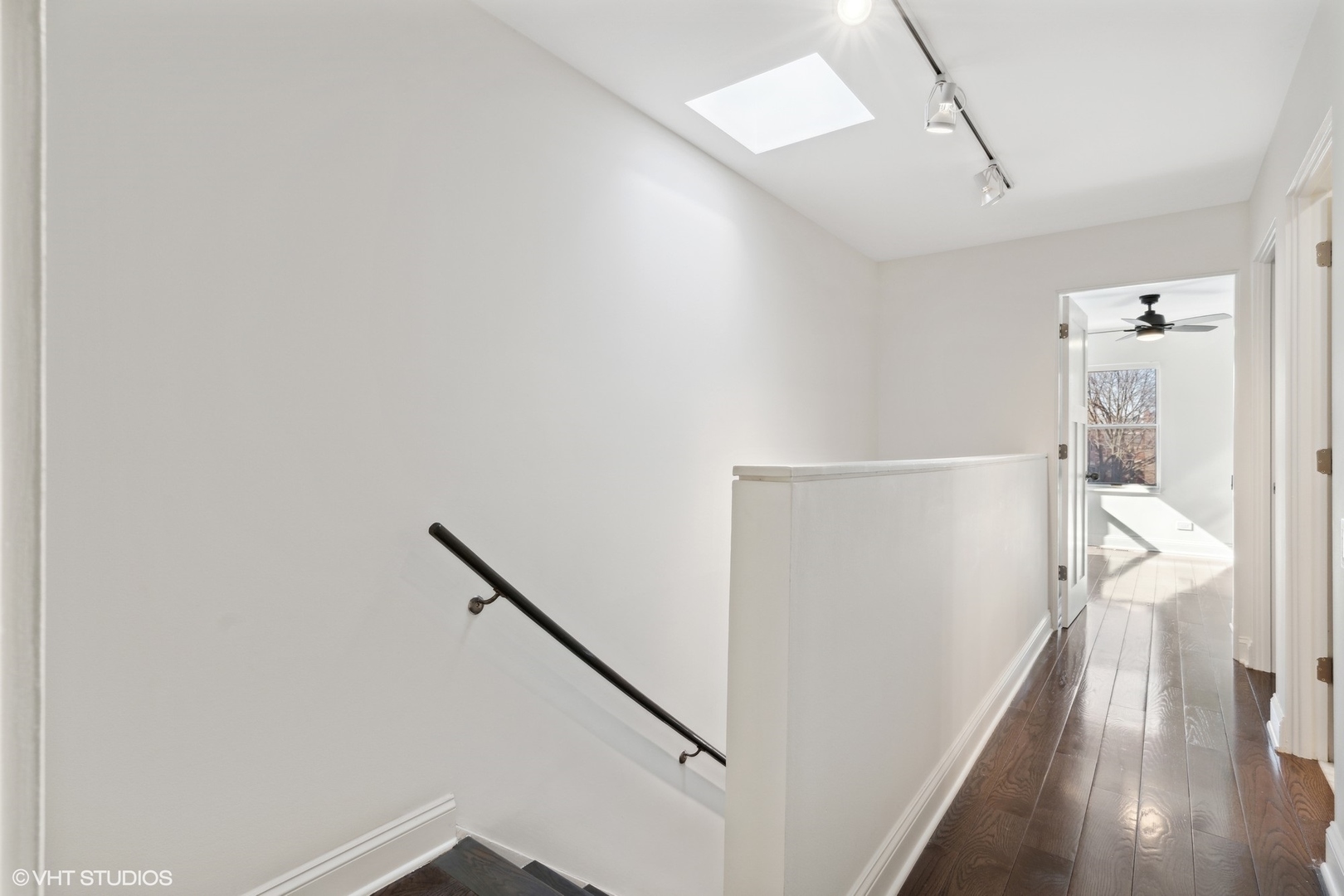 641 West Willow Street, Unit 117 Chicago, IL 60614 - Photo 29 of 44 a view of a hallway with wooden floor and staircase