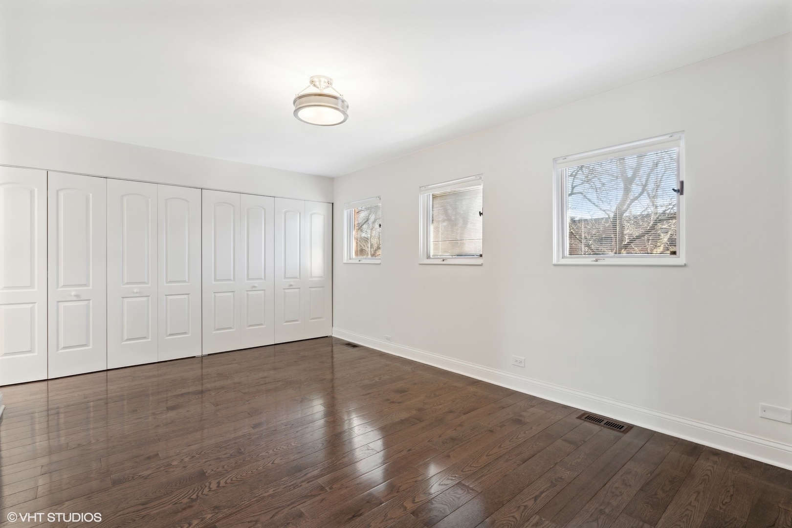 641 West Willow Street, Unit 117 Chicago, IL 60614 - Photo 30 of 44 a view of an empty room with wooden floor