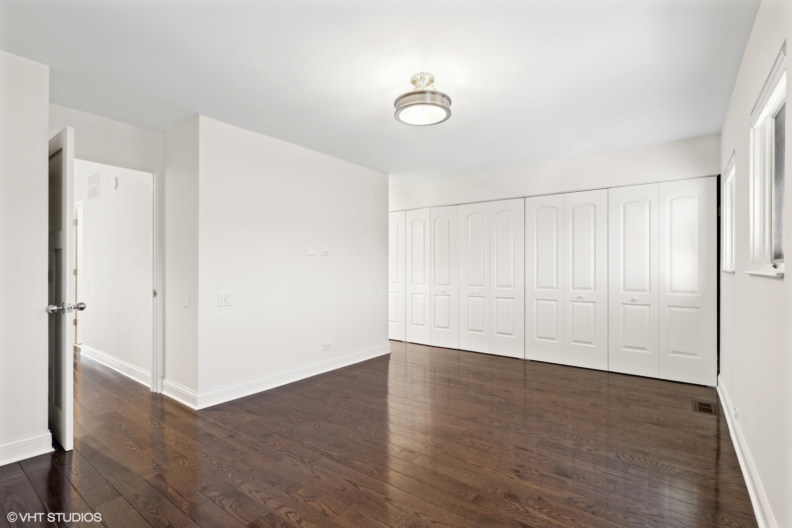641 West Willow Street, Unit 117 Chicago, IL 60614 - Photo 31 of 44 a view of an empty room with wooden floor