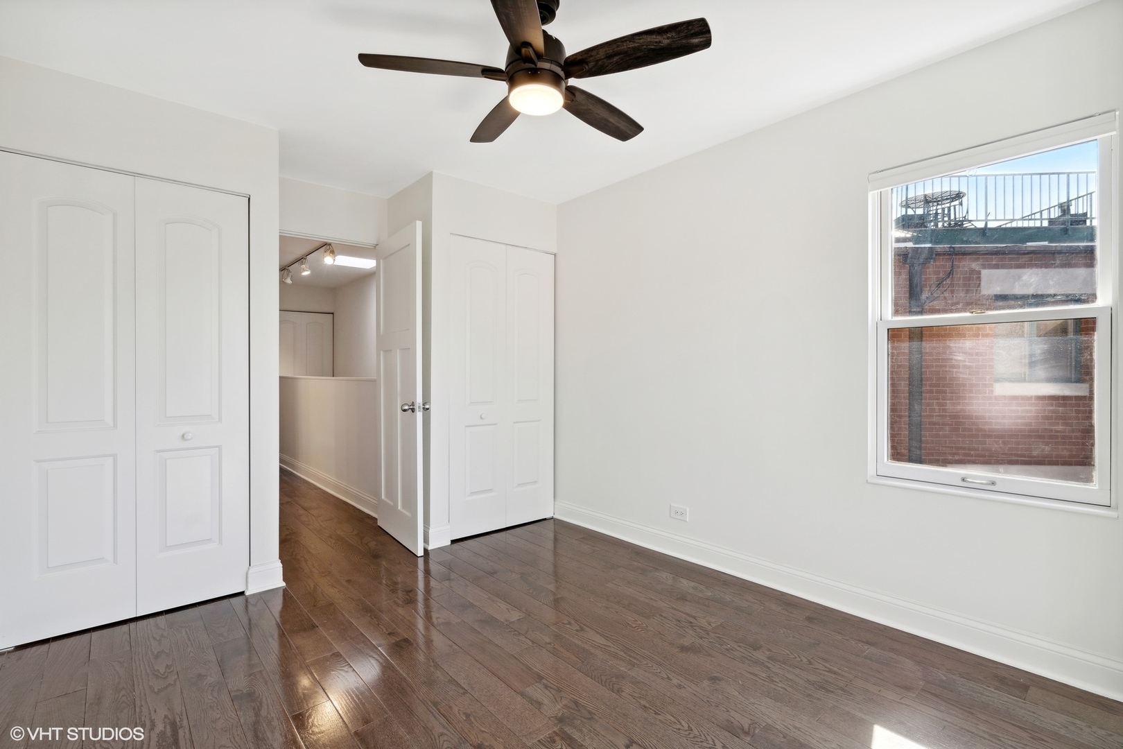 641 West Willow Street, Unit 117 Chicago, IL 60614 - Photo 38 of 44 a view of empty room with wooden floor and fan